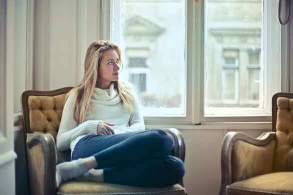 woman inside feeling the cabin fever feels