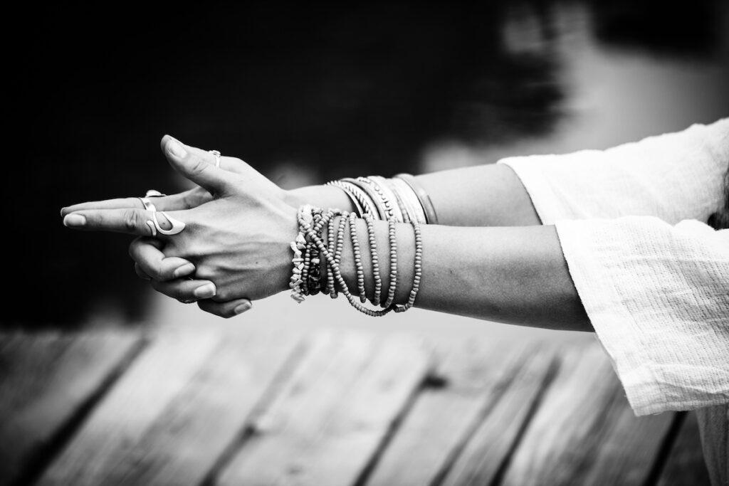 woman hands in yoga symbolic gesture