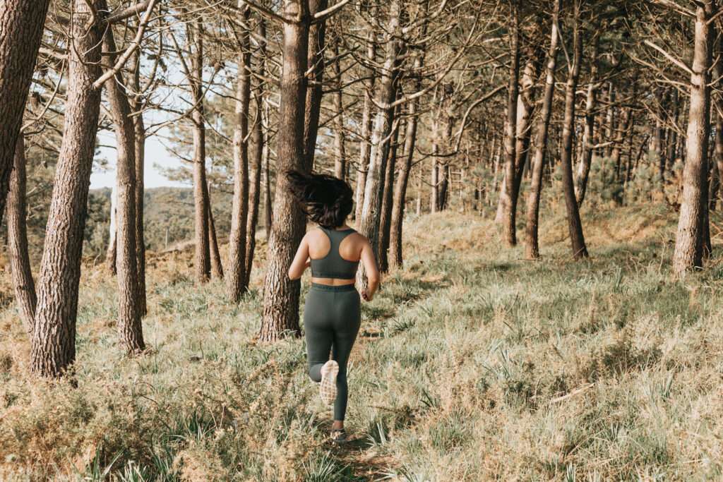 woman running in the forest for brain health