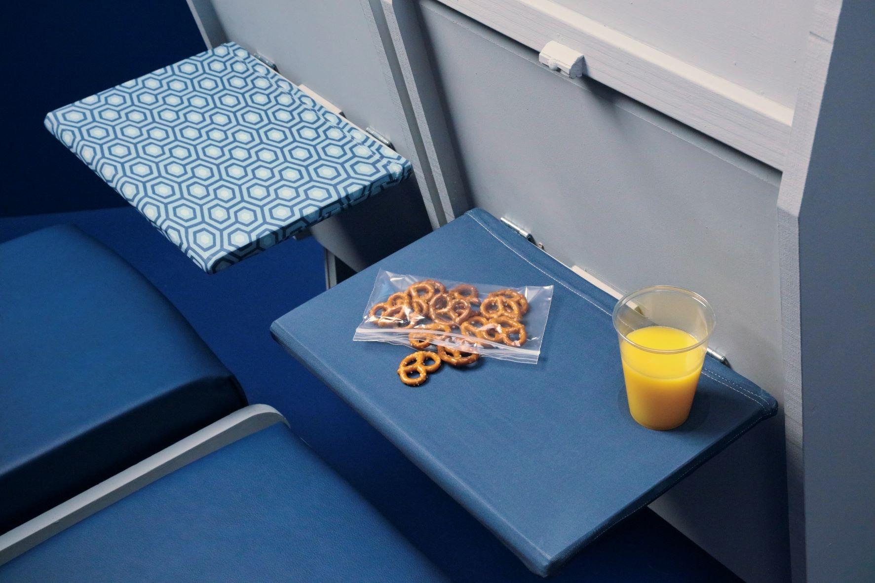 Airplane Pockets are a stretchable cover for airplane tray tables that